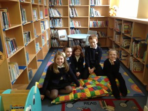 Our lovely new look library with the Pupil council members who organised it.